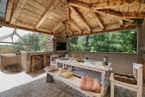 an outdoor dining area with a table and chairs at Villa Amelie in Kaštelir