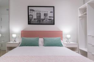Posteľ alebo postele v izbe v ubytovaní Apartamentos Miraflores