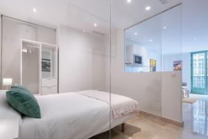 Posteľ alebo postele v izbe v ubytovaní Apartamentos Miraflores