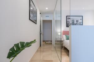 Posteľ alebo postele v izbe v ubytovaní Apartamentos Miraflores