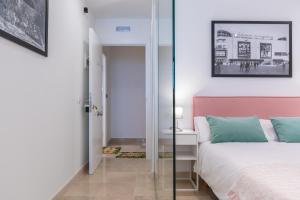 Posteľ alebo postele v izbe v ubytovaní Apartamentos Miraflores