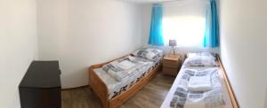 Postel nebo postele na pokoji v ubytování Schmidt Apartman 2.