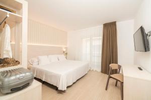 Een bed of bedden in een kamer bij Hotel Marsol