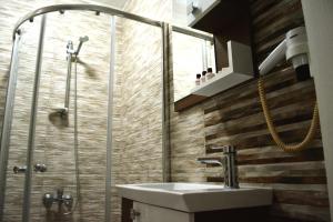 a bathroom with a sink and a shower at Bormali Hotel in Corlu +29 photos