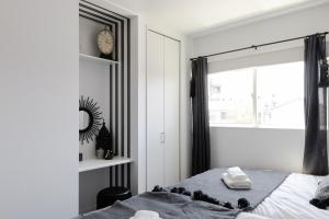 Postel nebo postele na pokoji v ubytování KANADE House