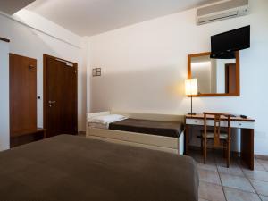 Postel nebo postele na pokoji v ubytování Hotel Florence