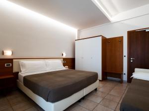 Postel nebo postele na pokoji v ubytování Hotel Florence