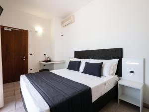 Postel nebo postele na pokoji v ubytování Hotel Florence