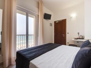 Postel nebo postele na pokoji v ubytování Hotel Florence