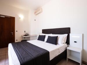 Postel nebo postele na pokoji v ubytování Hotel Florence