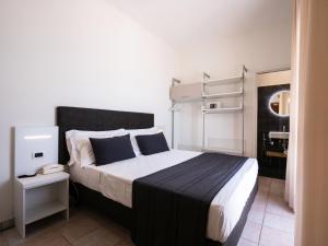 Postel nebo postele na pokoji v ubytování Hotel Florence