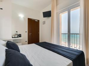 Postel nebo postele na pokoji v ubytování Hotel Florence
