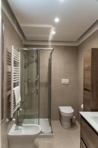 a bathroom with a shower and a toilet and a sink at Me&Sea B&B in San Nicola Arcella +35 photos