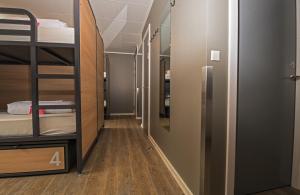 a corridor of a dorm room with bunk beds at Generator Copenhagen in Copenhagen