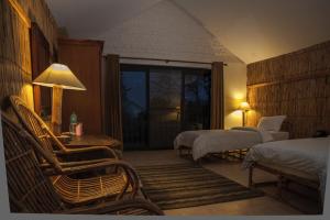 Postel nebo postele na pokoji v ubytování Siddhartha Wildlife Retreat + 37 fotografií