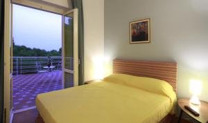 Letto o letti in una camera di Dimora Villa Serena Porto Selvaggio