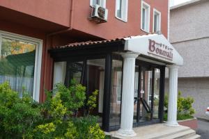 a building with a sign on the front of it at Bormali Hotel in Corlu