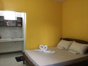 Postel nebo postele na pokoji v ubytování Panglao Rainbow Inn