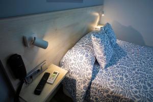 Posteľ alebo postele v izbe v ubytovaní Hotel Bari