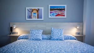 Posteľ alebo postele v izbe v ubytovaní Hotel Bari
