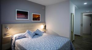 Posteľ alebo postele v izbe v ubytovaní Hotel Bari