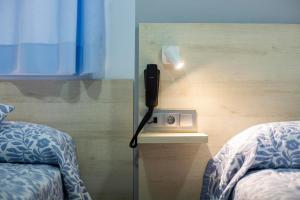 Posteľ alebo postele v izbe v ubytovaní Hotel Bari