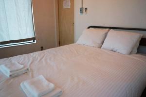 Kama o mga kama sa kuwarto sa Tagore Harbor Hostel
