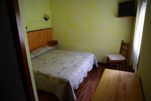 Posteľ alebo postele v izbe v ubytovaní Albergo Del Ponte