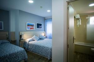 Posteľ alebo postele v izbe v ubytovaní Hotel Bari