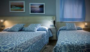 Posteľ alebo postele v izbe v ubytovaní Hotel Bari