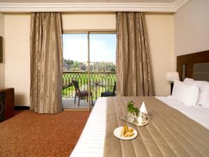 Postel nebo postele na pokoji v ubytování Palais Medina Riad Resort