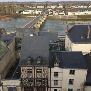 an aerial view of a building next to a river at Cosy studio, at foot of - au pied du, Château d'Amboise in Amboise