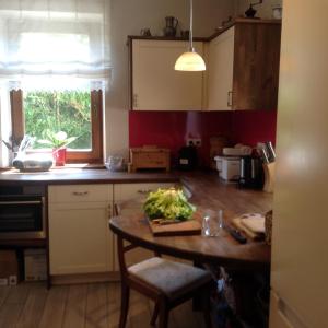 a kitchen with a table with vegetables on it at Ferienhaus Inselweg in Faak am See