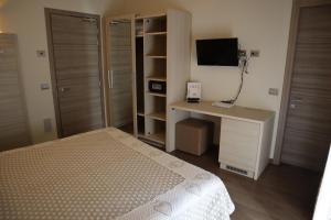 Posteľ alebo postele v izbe v ubytovaní Albergo Del Ponte