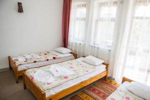 Postel nebo postele na pokoji v ubytování Atak Hotel