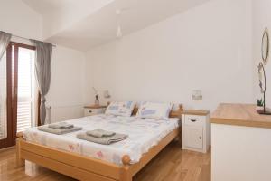 Postel nebo postele na pokoji v ubytování Apartment Oli