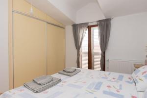 Postel nebo postele na pokoji v ubytování Apartment Oli