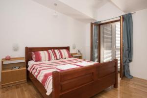 Postel nebo postele na pokoji v ubytování Apartment Oli