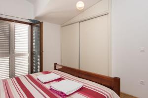 Postel nebo postele na pokoji v ubytování Apartment Oli
