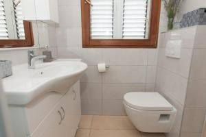 Koupelna v ubytování Apartment Oli