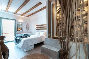 Ένα ή περισσότερα κρεβάτια σε δωμάτιο στο Bohemian Luxury Boutique Hotel, Adults Only