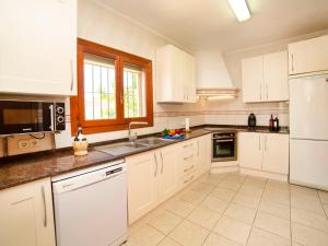 Kuchyň nebo kuchyňský kout v ubytování Villa Charme by Interhome