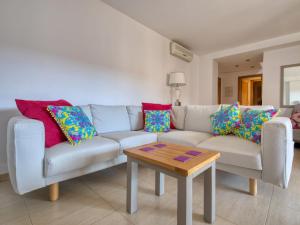 a living room with a couch and a coffee table at Apartment Residencial Roma by Interhome in Jávea