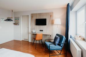 TV a/nebo společenská místnost v ubytování Siel59 Hotel & Restaurant