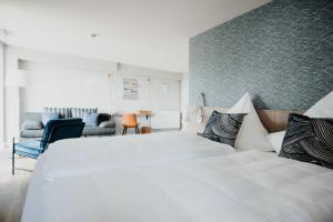 A bed or beds in a room at Siel59 Hotel & Restaurant