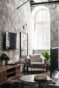 Televízia a/alebo spoločenská miestnosť v ubytovaní House of Loft Affair