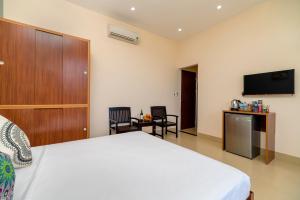 Μια τηλεόραση ή/και κέντρο ψυχαγωγίας στο Private room at Hoi Ana Golden walls Homestay - Swimming pool