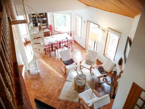 an aerial view of a living room with a table and chairs at Casa da Balseira in Aveiro
