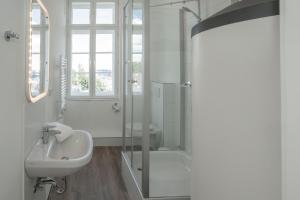 a bathroom with a sink, toilet and tub at Boardinghouse Flensburg - by Zimmer FREI! Holidays in Flensburg