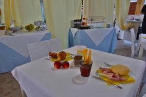 a table with a plate of food on a table at Sole E Luna in San Teodoro